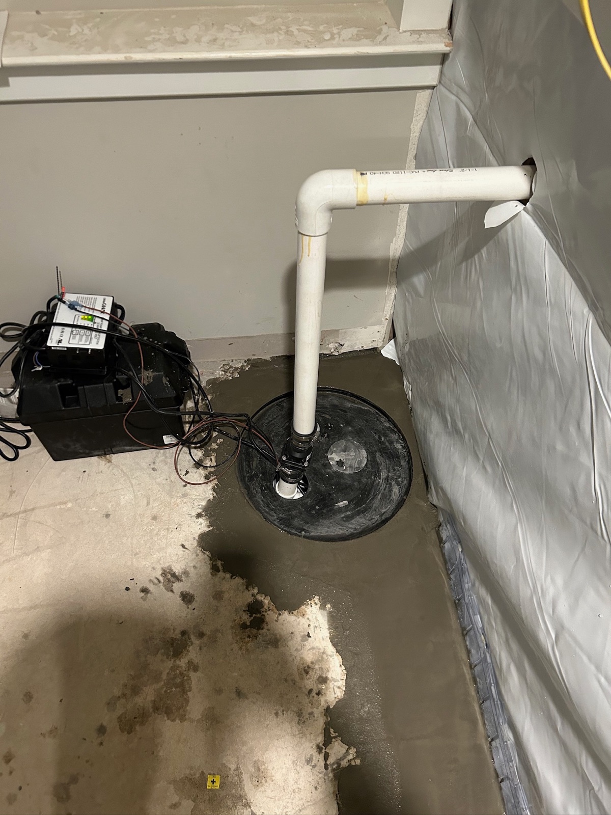 Finished, dry basement after interior drainage and sump pump installation