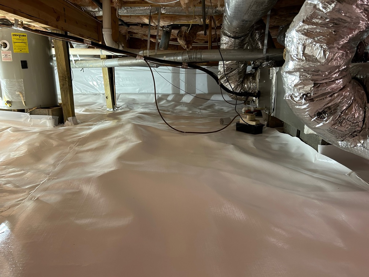 Finished crawl space encapsulation with sealed vapor barrier and a dehumidifier holding humidity down