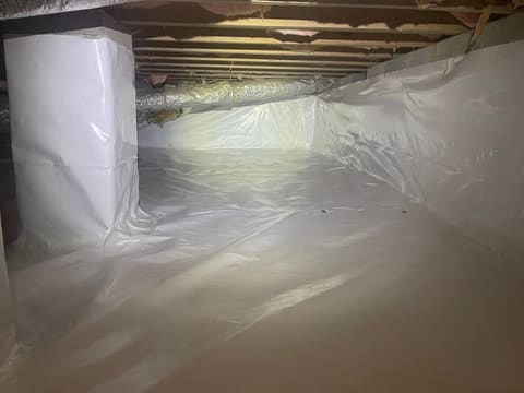 Finished crawl space encapsulation with sealed vapor-barrier walls and a dehumidifier — Crawl Daddy, Metro Atlanta