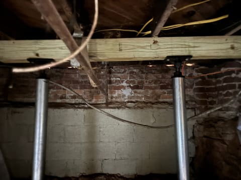 Structural support reinforcement under a Metro Atlanta home — Crawl Daddy foundation repair